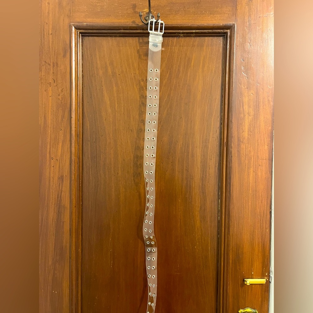 Plastic belt with metal cutouts